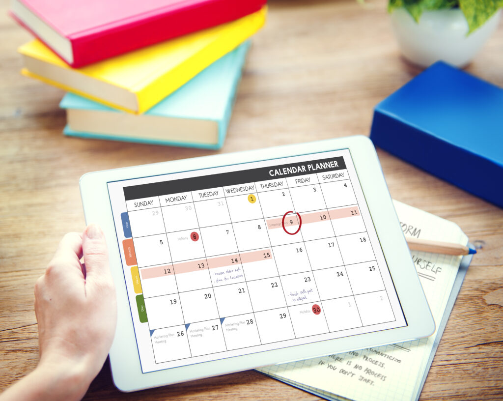 Man using tablet and Calendar Concept